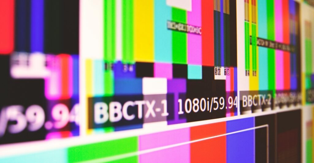 A multicolour broadcast channel screen before videos are loaded into it.