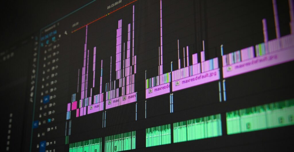 A PremierPro edit timeline page on a desktop screen. Purple video clips with FX stamps sit at the top of the screen and green audio tracks lay at the bottom of the screen.